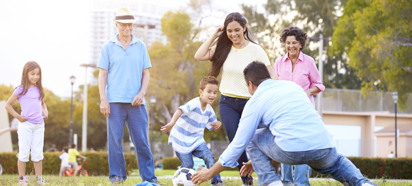 Family playing soccer